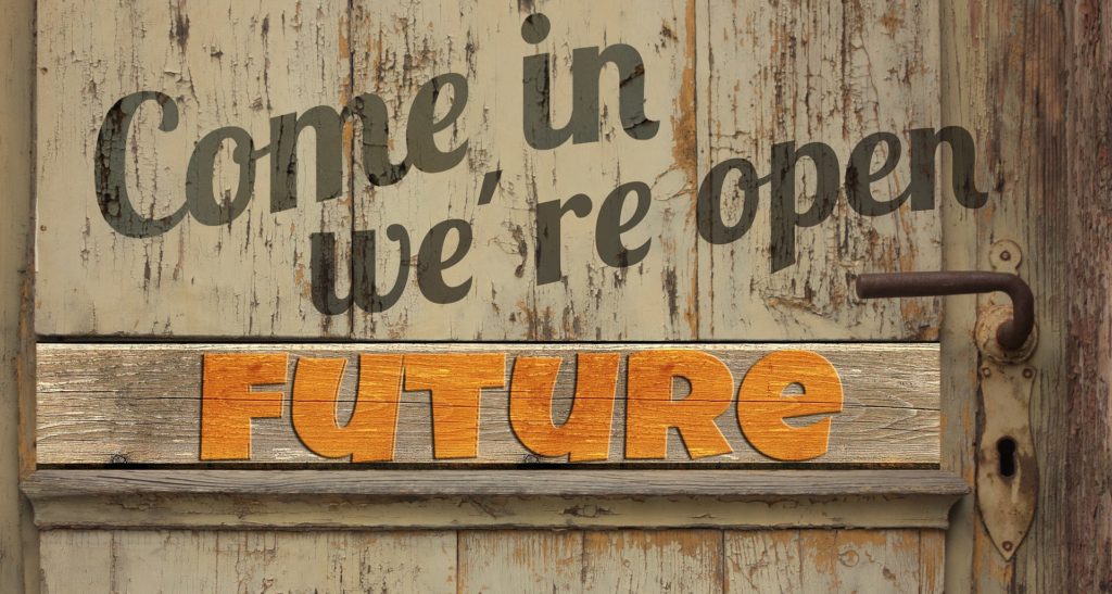 Del av en dør, med skilt med tekst: Future. Over står det: Come in, we're open